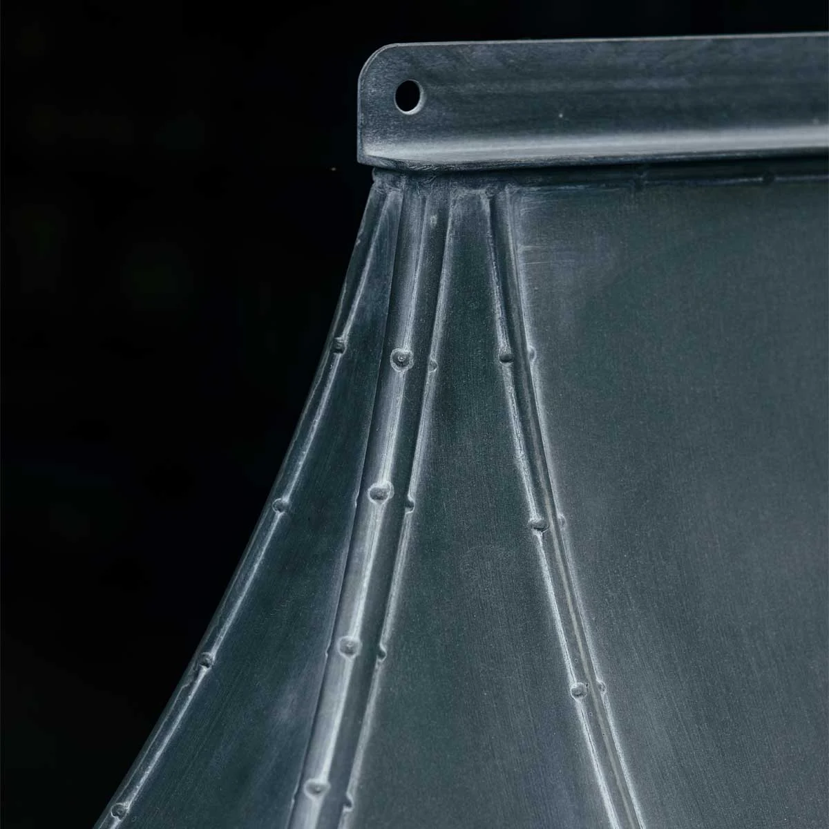 aged-galvanized-steel-porch-01 A closeup of a galvanized zinc steel porch showing the welded details and metalwork seams which have been aged