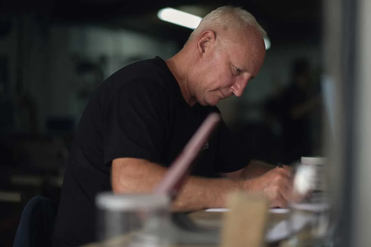 A portrait of Garden Requisites founder John Thurman at work