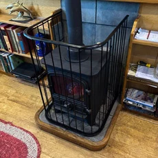 Custom fireguard set in a narrow boat