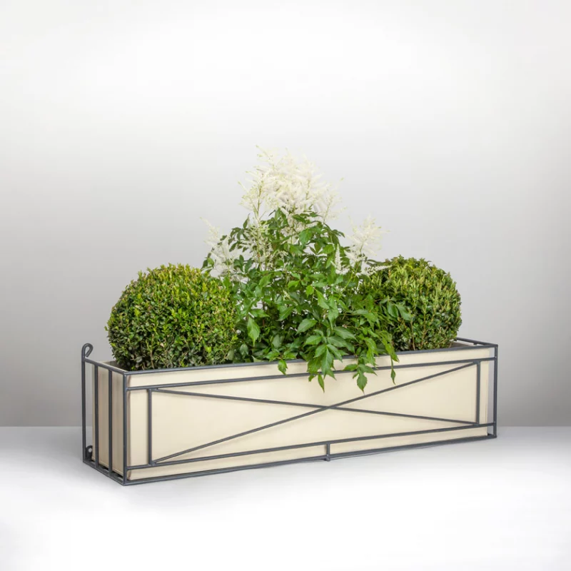 Ironwork window box with plants