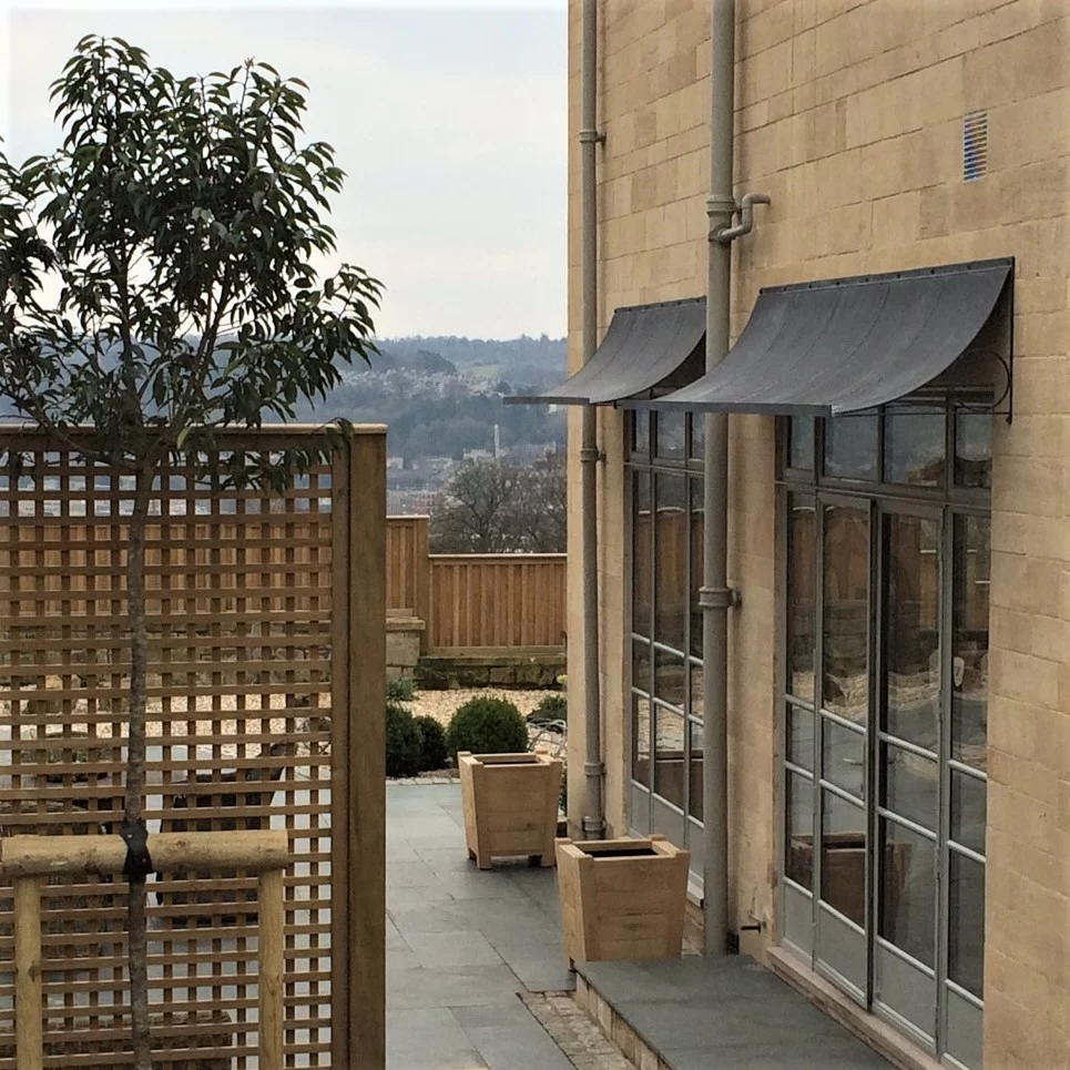 Zinc door canopies over French Doors