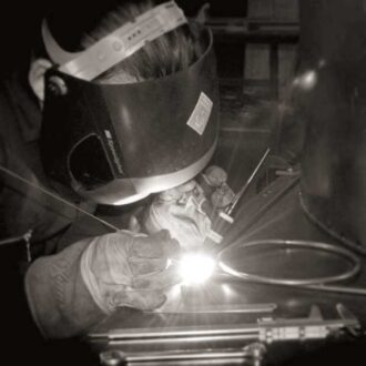 A close up of metal being welded in the workshop