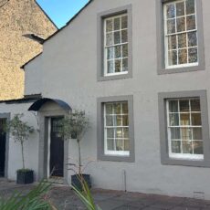 A metal canopy above the front door of a residential property